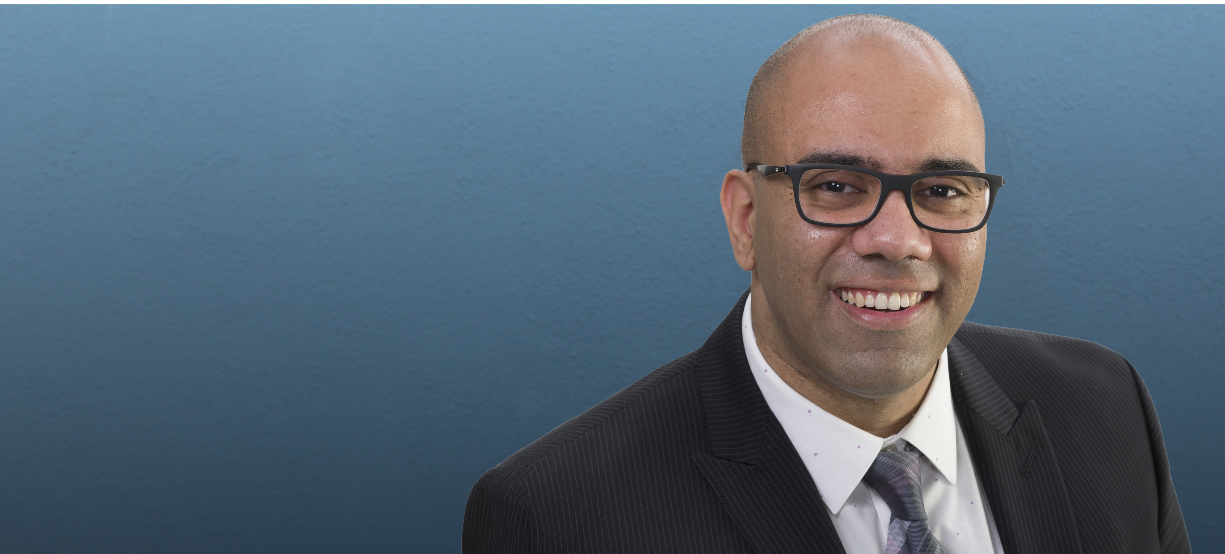Doctor Amro Elkhatieb in a dark suit jacket
